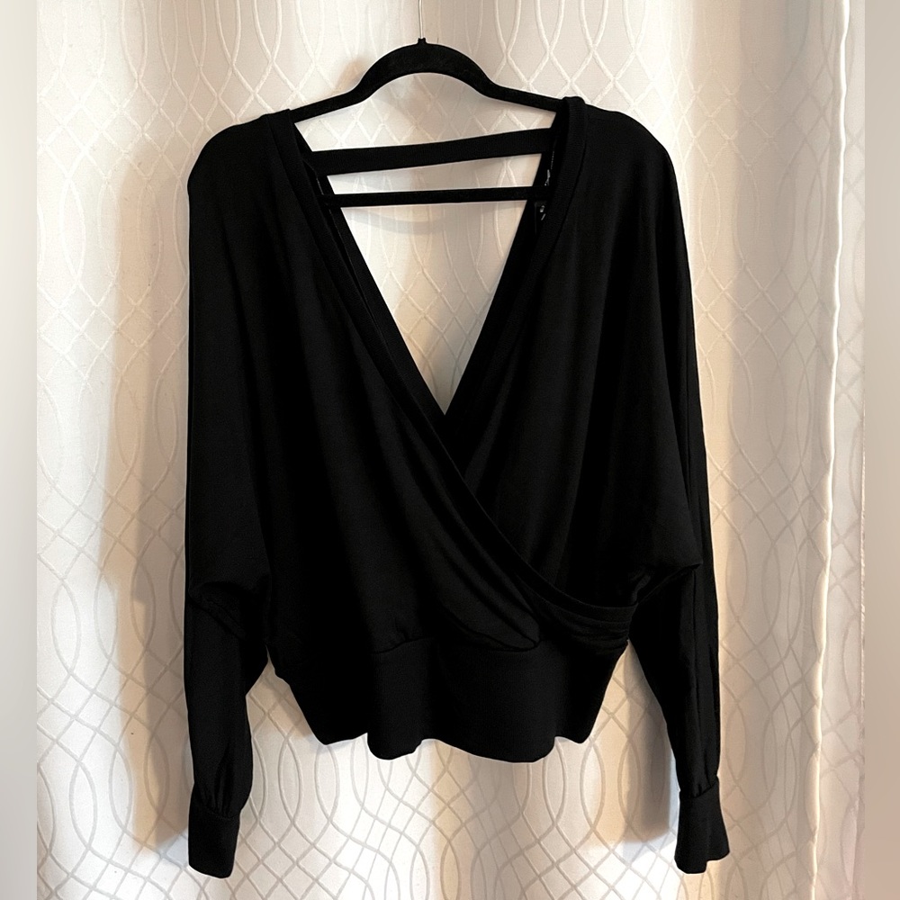 Express Black long sleeve sweater top with banded bottom and back strap detail